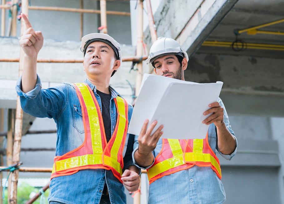 young-asian-engineers-caucasian-engineer-colleagues-site-inspector-discuss-together-using-