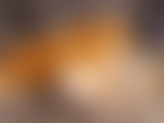 A puppy and kitten laying down and resting.