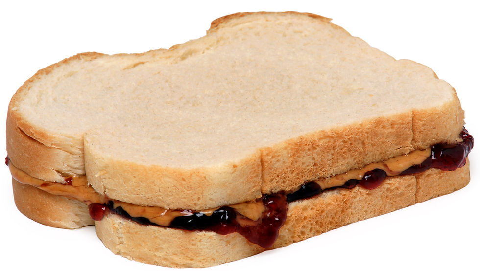 Peanut butter and jelly sandwich with grape jelly on white bread.