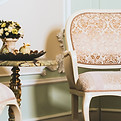 wide-closeup-shot-flower-bouquet-vase-table-near-elegant-armchair.jpg