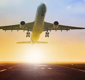 Airplane flying against a clear sky, representing travel and relocation to Spain.