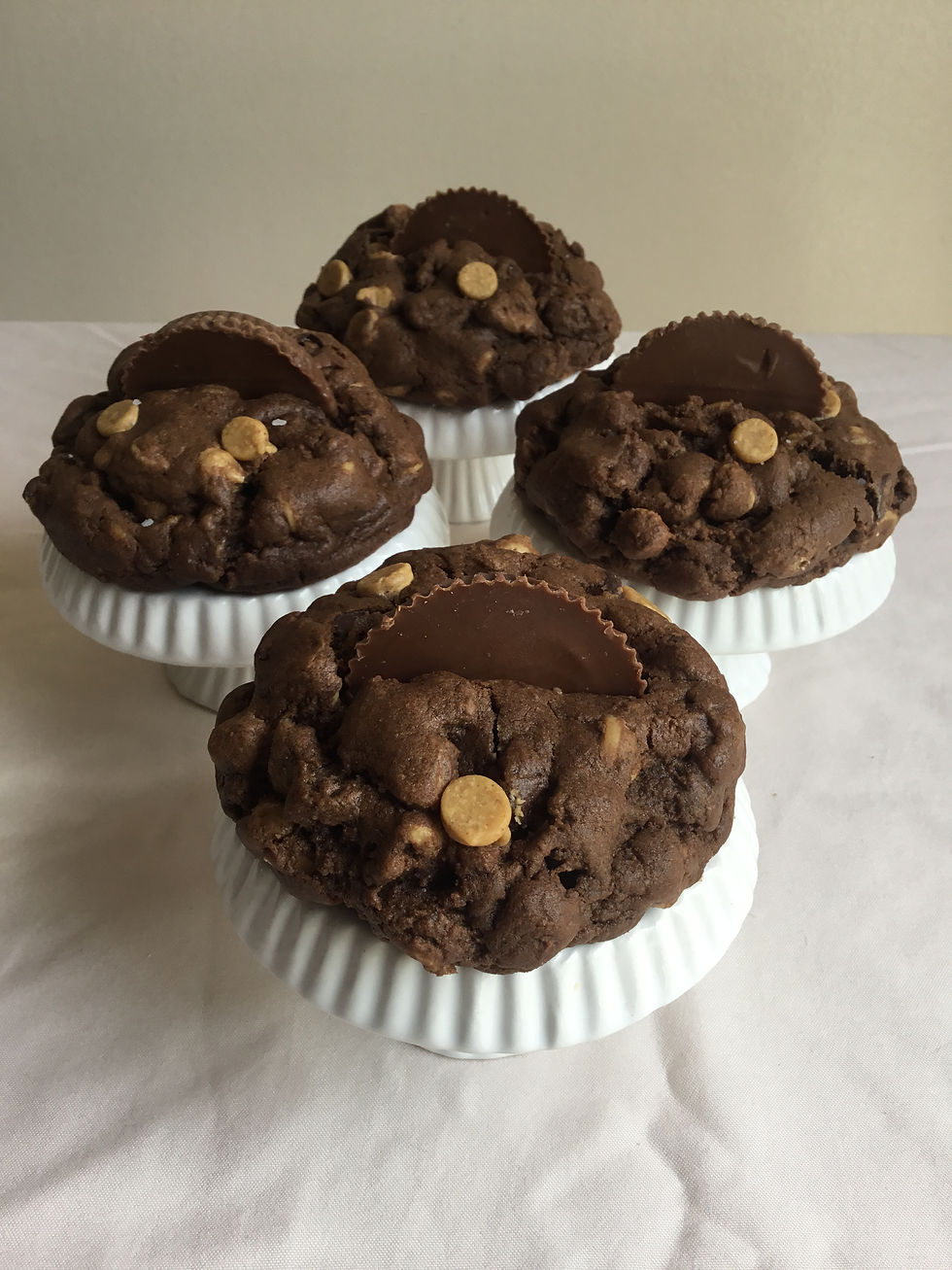 Thick chocolate cookies with peanut butter chips topped with Reese's peanut butter cups