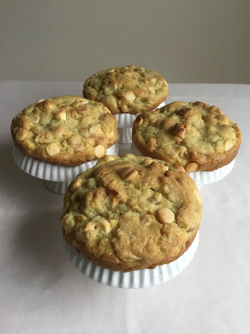 Thick orange cookies with white chocolate chips