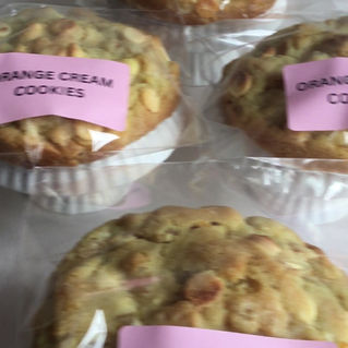 Video of packaged orange cookies with white chocolate chips