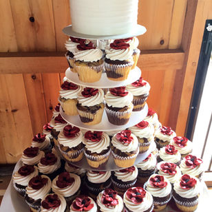 Textured buttercream cutting cake and cupcakes, displayed on a round acrylic cupcake stand delivered at Honeysuckle Ridge, Airville PA.