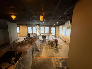 Walls, ceilings, and stained woodwork.