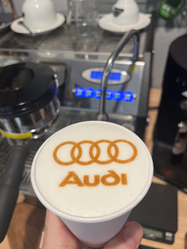 Latte with Audi logo art from Intentional Espresso’s white-label coffee catering in Portland