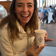 Guest holding a custom branded coffee cup at a live event or brand activation