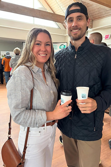 female and male couple holidng hot coffees at the Lake Oswego Parks and Rec aquatic center grand opening