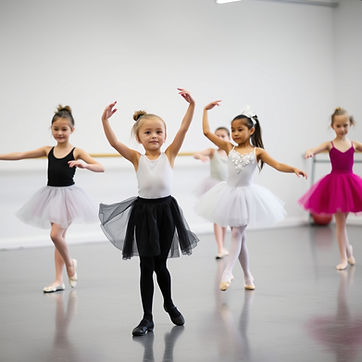 8 YEAR OLD BALLET DANCERS DANCING IN A STUDIO.jpg