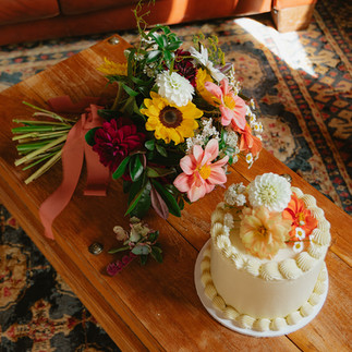 A photo of the stunning cake and beautiful bouquet.