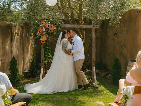 A couple enjoy their first married kiss at the Valentine's Day Pop Up wedding.