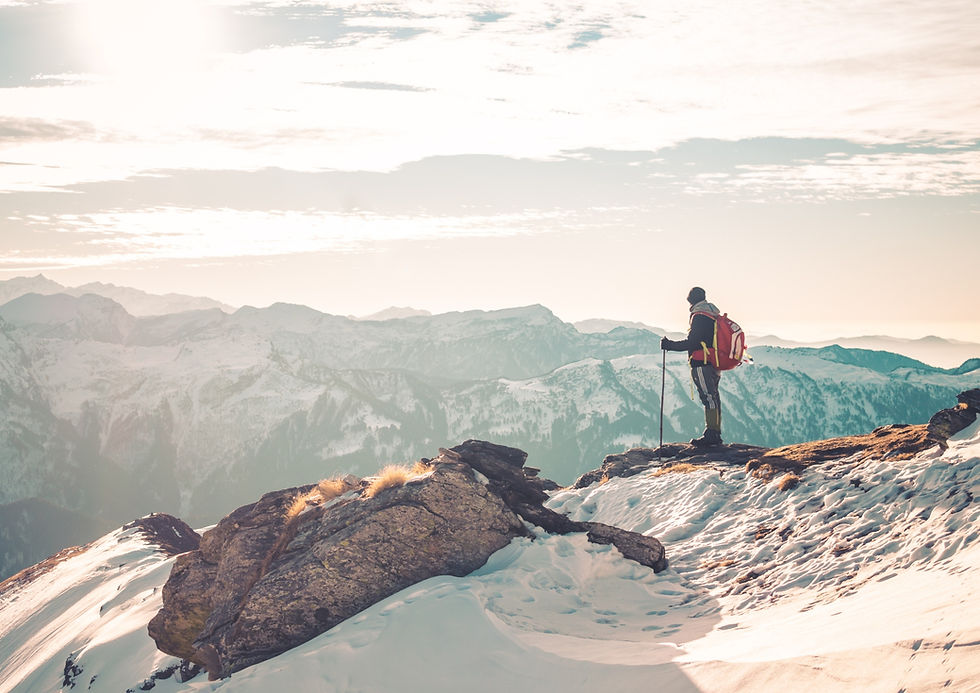 Trekker enjoying the beautiful mountain scenery at a high altitude trekking in Nepal