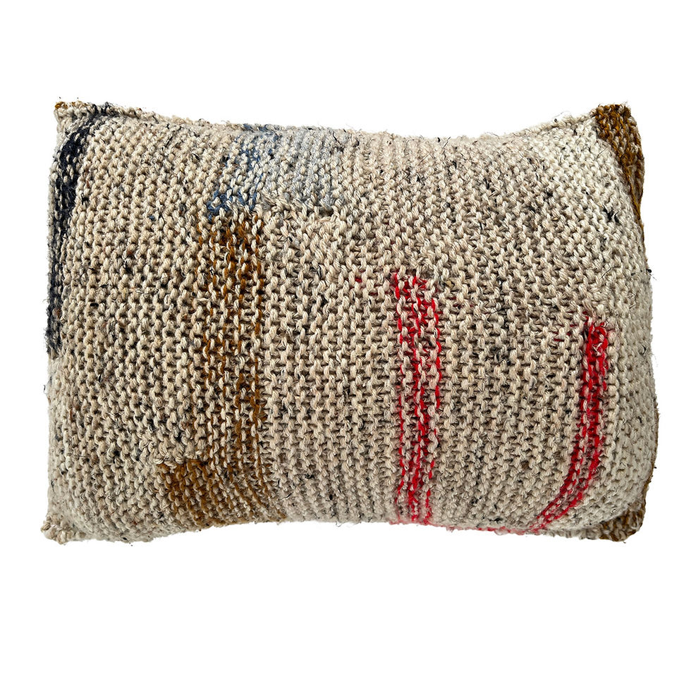 Reverse side of Signal to Aunt Donna pillow by Robyn O'Neil showing textured knit with red and brown details