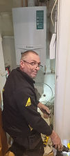 Team member installing a boiler
