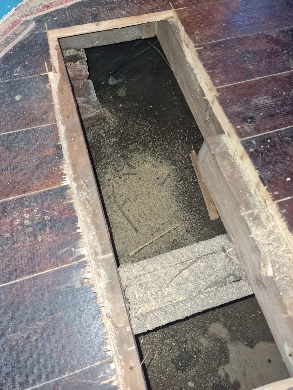 The team has cutting to the floor to find where the leak is, exposing the underneath bottom part of the house