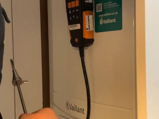     Enginer conducts a performance test on a Vaillant boiler to ensure safety and efficiency.