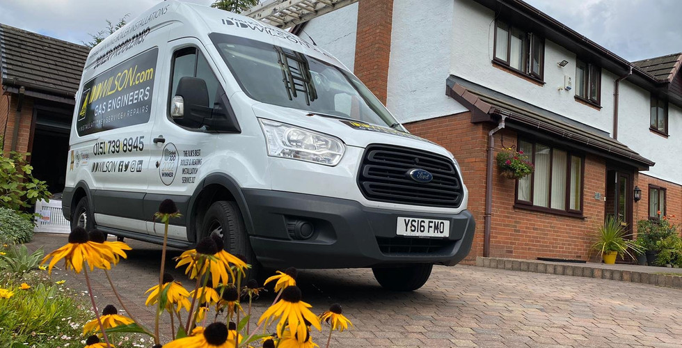 White DDWilson van Outside Property