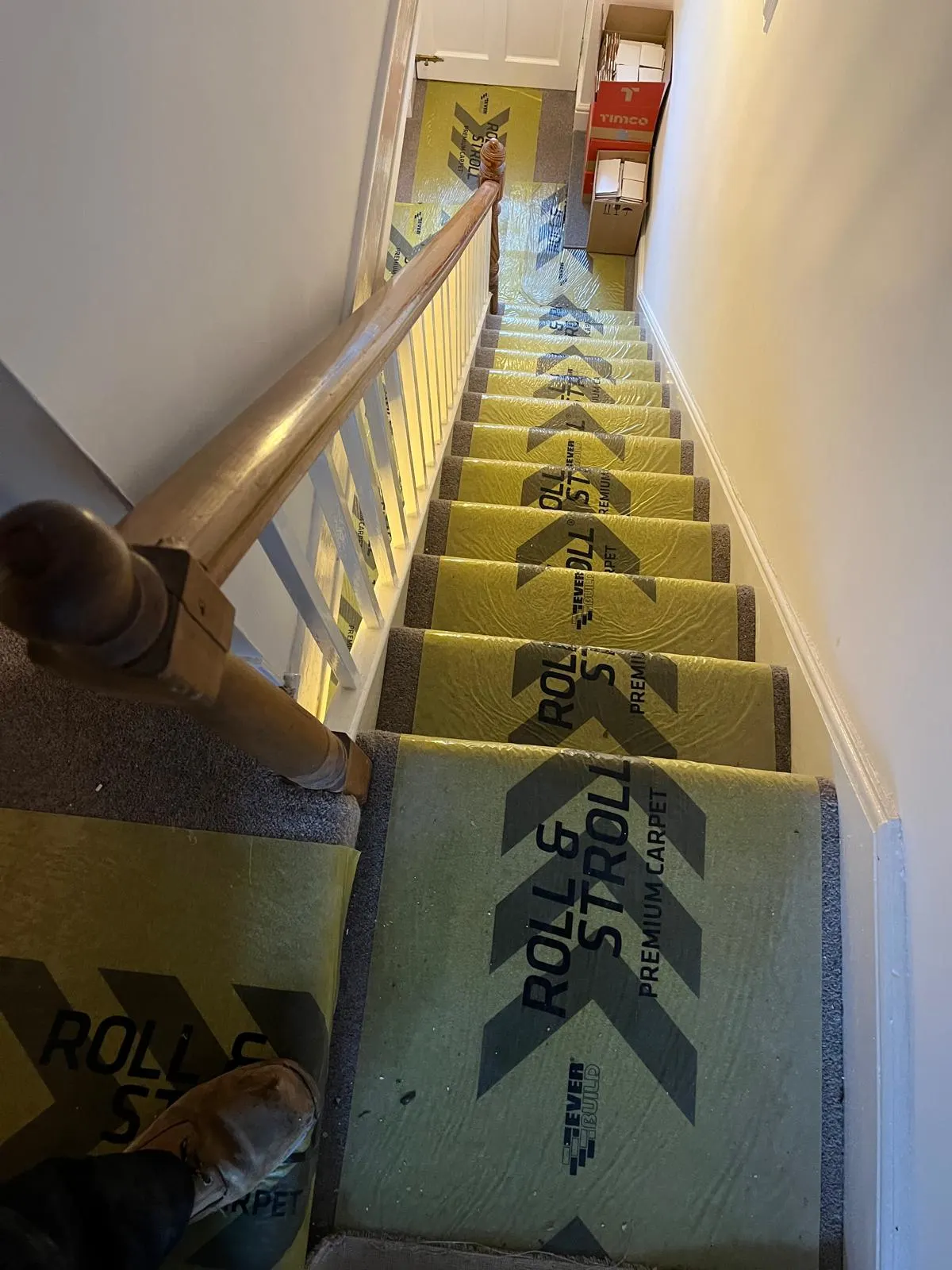 Staircase, where the stairs have been covered with protection film.