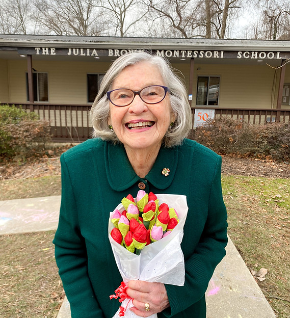 Ms. Brown in front of Julia Brown Schools in Laurel, MD