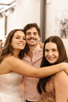 The bride hugging guests at her rehearsal dinner