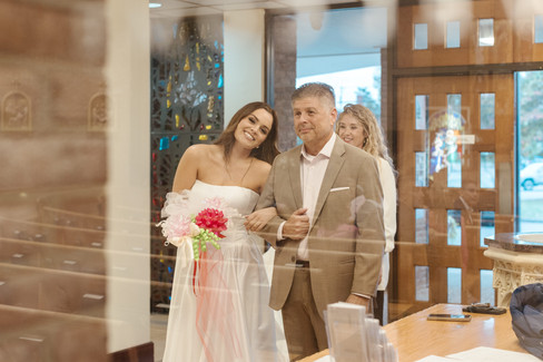 The bride and her father walking down the aisle at rehearsal dinner