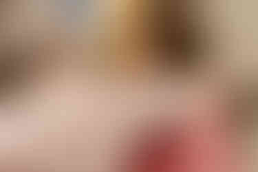 A candid moment of family members hugging and laughing