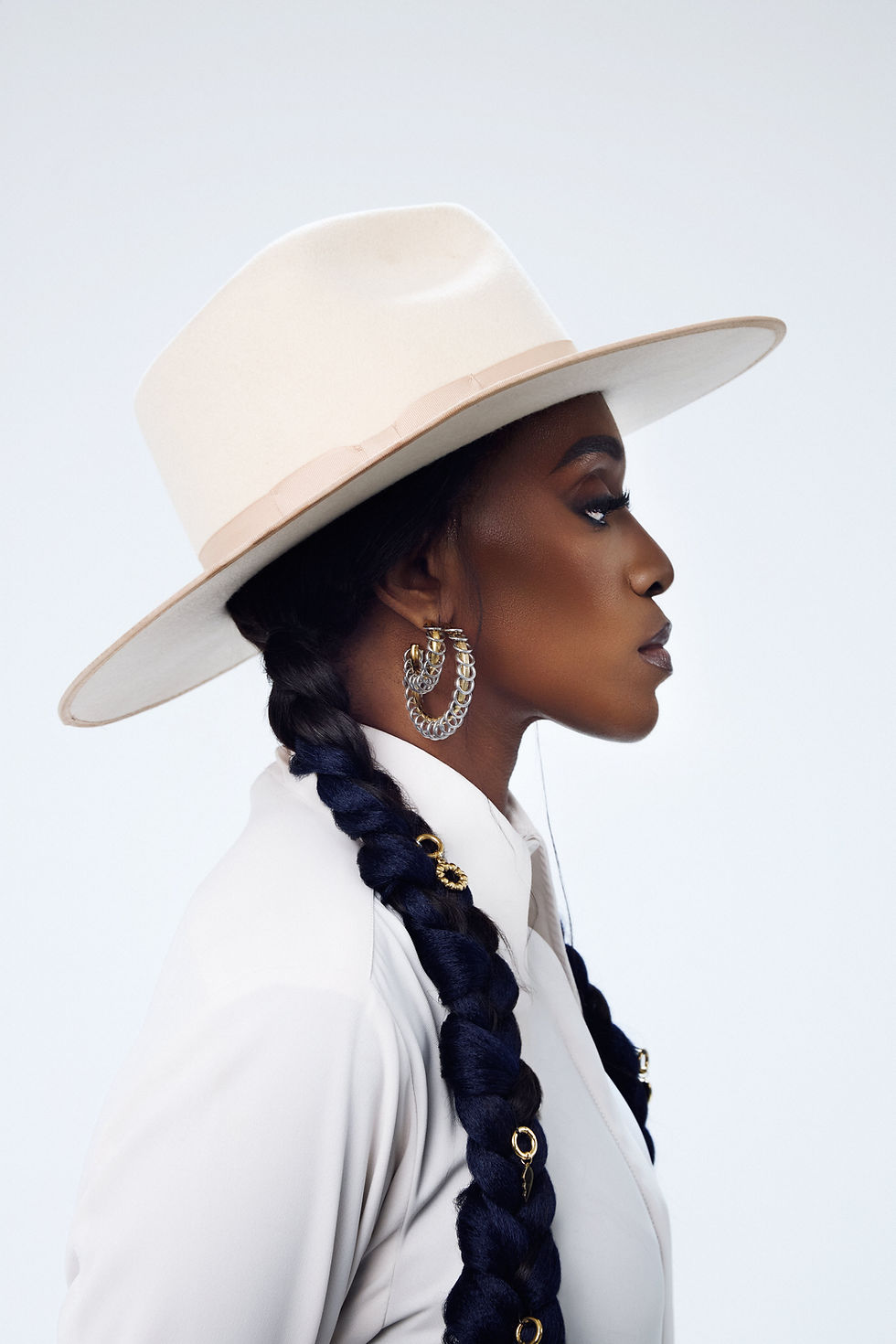 Statement gold hoop earrings, tarnish-resistant and lightweight.