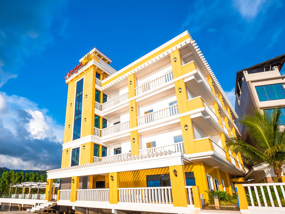 A photo of the Sunlight Hotel Coron facade during the day facing the Coron Bay
