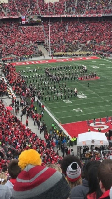 Ohio State marching band performing at a packed stadium