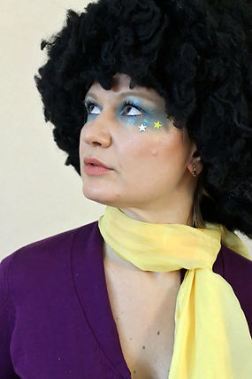 Very traditional 70's Disco era, time makeup look, bright blue, gliiter with stars