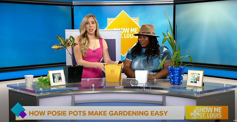 Mary and Kay was discussing gardening pots on "Show Me St. Louis." They display colorful plant pots and decor on a glass table in a studio setting.