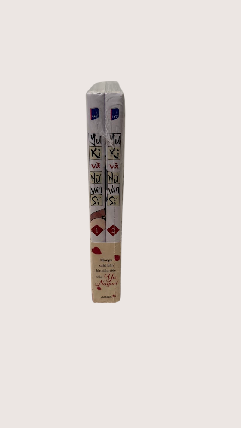 Two books, with visible text and detail, Yuki và Nữ Văn Sĩ - Amakbooks.
