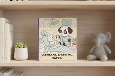 Children’s coloring book titled Animal Dental Days displayed on a wooden bookshelf with soft natural light