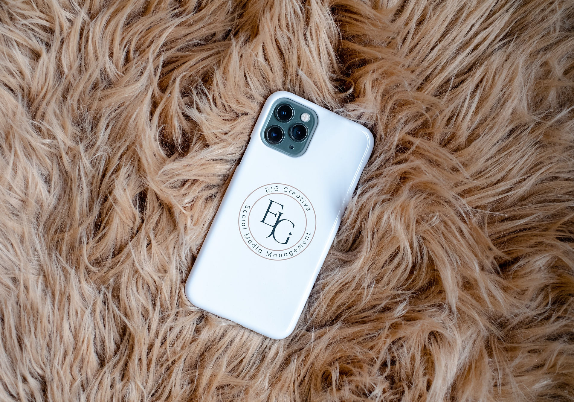 EJG Creative submark logo design mock up on white phone cover