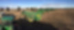 Line up of John Deere machinery at harvest time