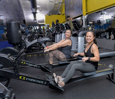 Two women on rowing machines at Vero Fitness