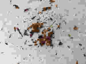 Tiny shavings of dark chocolate on a parchment paper