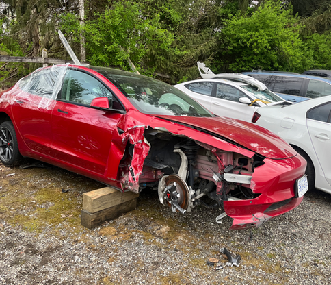 crashed red tesla