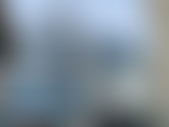 A crane is hoisting heavy machinery