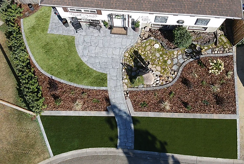 Aerial view of a landscaped front yard with stone pathway Landscape Consulting