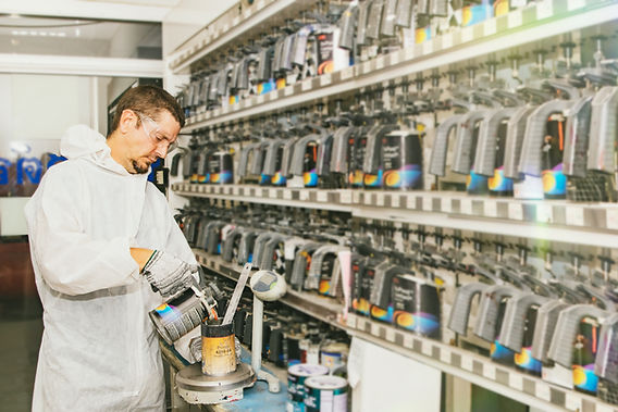 Technician mixing custom paint
