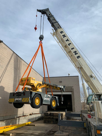 machinery being moved by crane