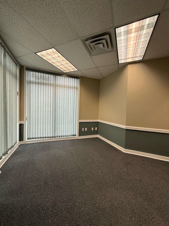 Commercial painting in an office with beige and gray walls