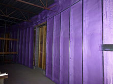 Purple spray foam insulation on interior walls