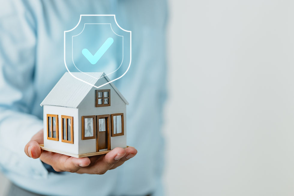 Hand holding house model with secure shield icon
