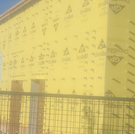 Spray Foam Application Exterior yellow building