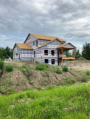 New construction house under development with weather wrap.