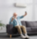 personsittion on couch turning ac on