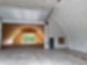 Large agricultural building interior with insulated arched section